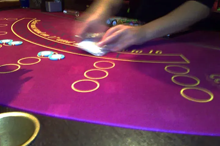 Live dealer dealing at the table
